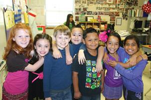 7 elementary students standing in a line 7 elementary students standing in a line
