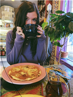 Ms. Menard drinking coffee